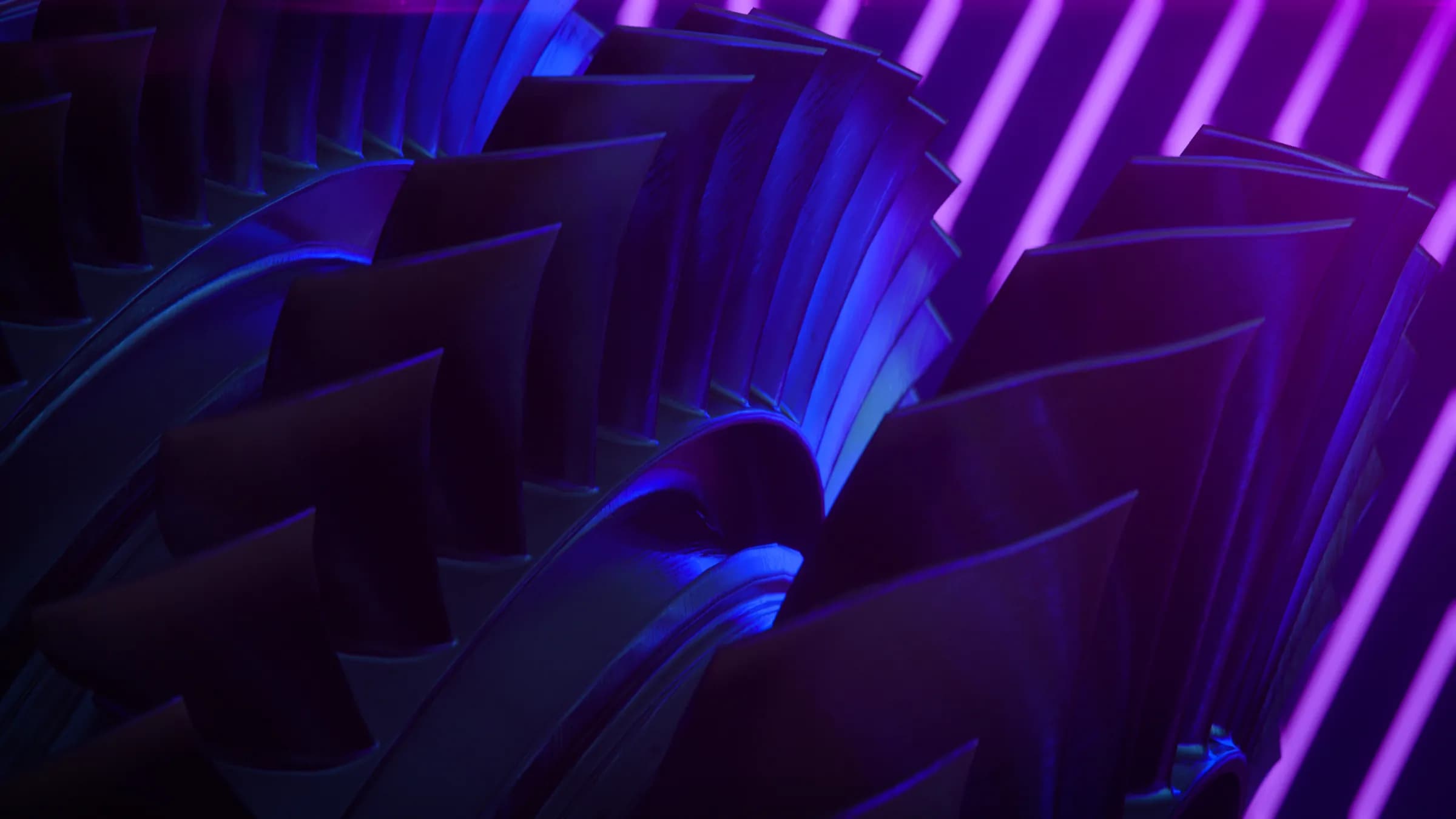 Engine fan blades lit in deep blue and violet
