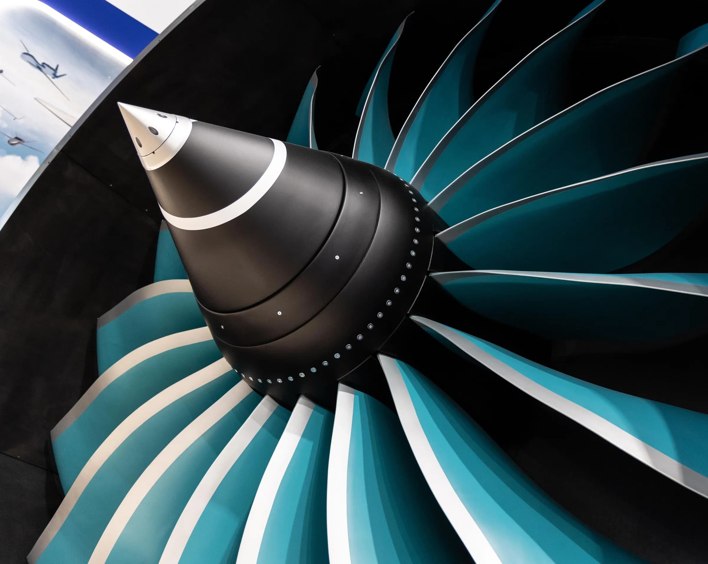 An engine spinner and fan blades in teal and black